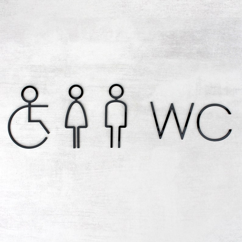 May include: Black and white WC sign with symbols for men, women, and wheelchair accessibility.