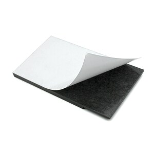 May include: A black adhesive-backed magnetic sheet with a white adhesive backing peeled back to reveal the magnetic surface.