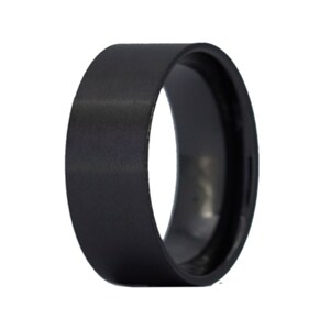 May include: A black brushed metal ring with a beveled edge. The ring is approximately 8mm wide.