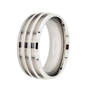 May include: A silver ring with a grooved design. The grooves are polished to a high shine, creating a contrast with the matte finish of the rest of the ring.