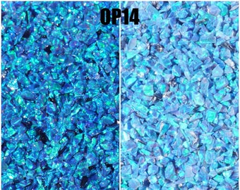 May include: A close-up image of blue opal chips, showing the difference in color when wet and dry. The image is labeled "OP14" and includes the text "Pictures are Property of OpalandFindings.Com OPAL & Findings All Rights Reserved".