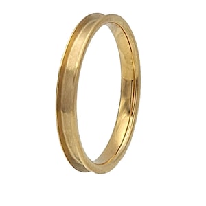 May include: A gold wedding band with a brushed finish.