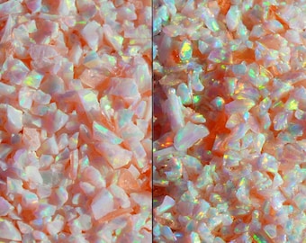 May include: Close-up image of iridescent opal chips, showing the difference in appearance when dry and wet. The chips are a mix of white and pink with a rainbow sheen. The text "OP79" is visible in the image. The text "Dry" is below the dry chips and the text "Wet" is below the wet chips.