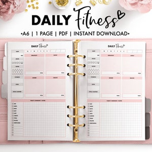 May include: A pink and white printable daily fitness planner with sections for sleep, mood, water, vitamins, steps, total calories, breakfast, lunch, dinner, snacks, and today's workout or notes. The planner is designed for a 6-ring binder.