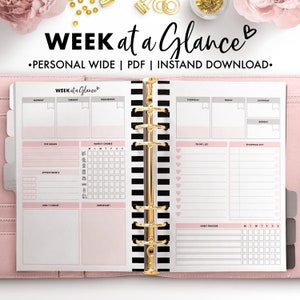 May include: A pink and white planner with a black and white striped spine. The planner has sections for "Top Goals", "Weekly Chores", "Appointments", "Don't Forget", "Important", "To-Do List", "Shopping List", and "Habit Tracker". The planner is titled "Week at a Glance".