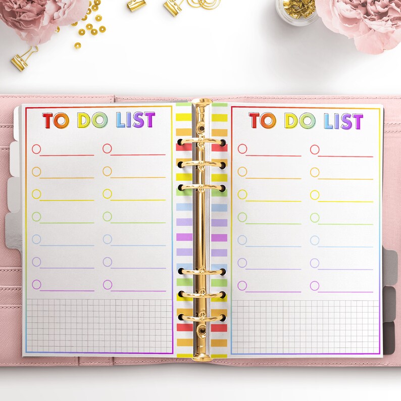 May include: A rainbow-colored to-do list planner with a gold binder. The planner has two pages with the text "TO DO LIST" at the top of each page. Each page has a grid pattern and a list of circles with lines next to them.