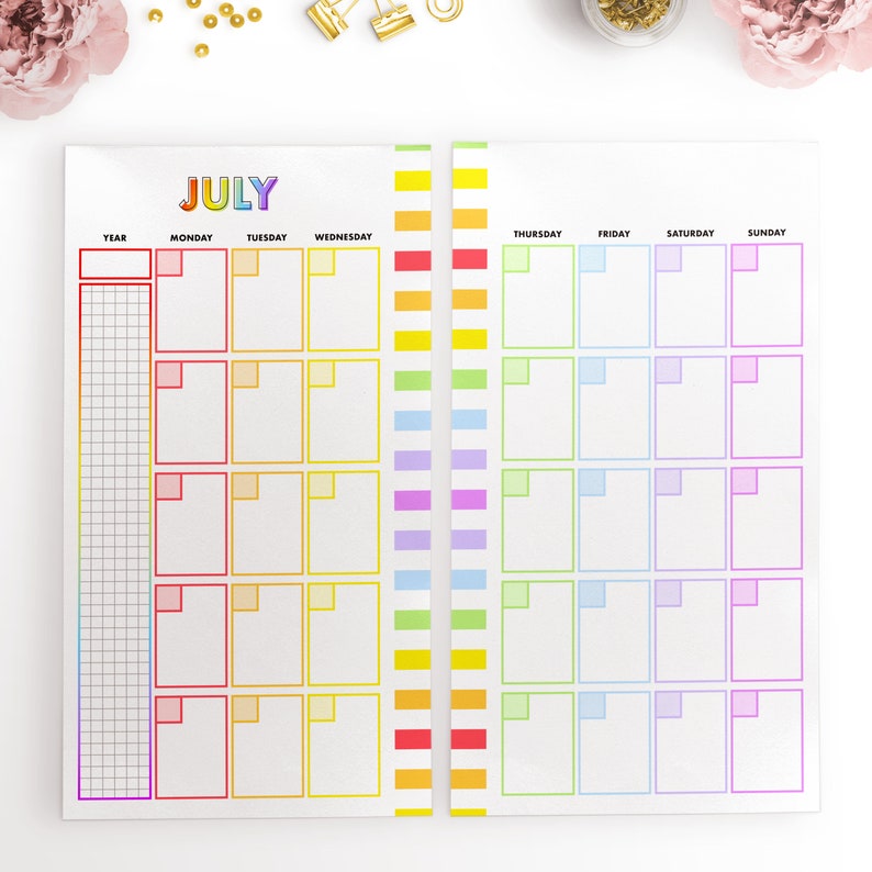 May include: A printable July calendar with rainbow colored borders. The calendar is divided into seven columns for each day of the week, with a separate column for the year. Each day has a box for writing in appointments or events.