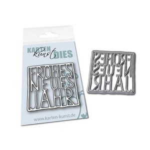 May include: A silver metal die cut featuring the words "Frohes Neues Jahr" in a bold, blocky font. The die cut is designed for crafting and scrapbooking.