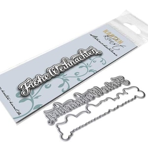Könnte beinhalten: Metall-Stanzform zum Basteln mit dem Schriftzug "Frohe Weihnachten" in einer dekorativen Schriftart. Die Stanzform enthält außerdem eine kleinere, separate Stanzform mit einem dekorativen Rand.