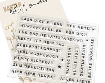 May include: Clear stamps with German phrases for birthdays and celebrations. Phrases include "Happy Birthday", "Alles Liebe", and "Best Wishes". The stamps are on a cream-colored backing with decorative flourishes.