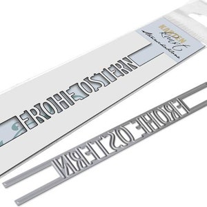 May include: Metal die cut for crafting, featuring the words "Frohe Ostern" in a silver finish. The die cut is shown on a white background.