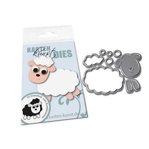 May include: A package of sheep-shaped craft dies with a matching die-cut set. The packaging features a cartoon sheep illustration with the text "Karten Kunst Dies" and "10 Einzelteile zum Kombinieren".