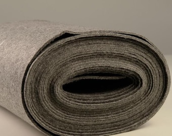 May include: A roll of gray felt fabric. The fabric is tightly rolled and has a smooth, even texture.