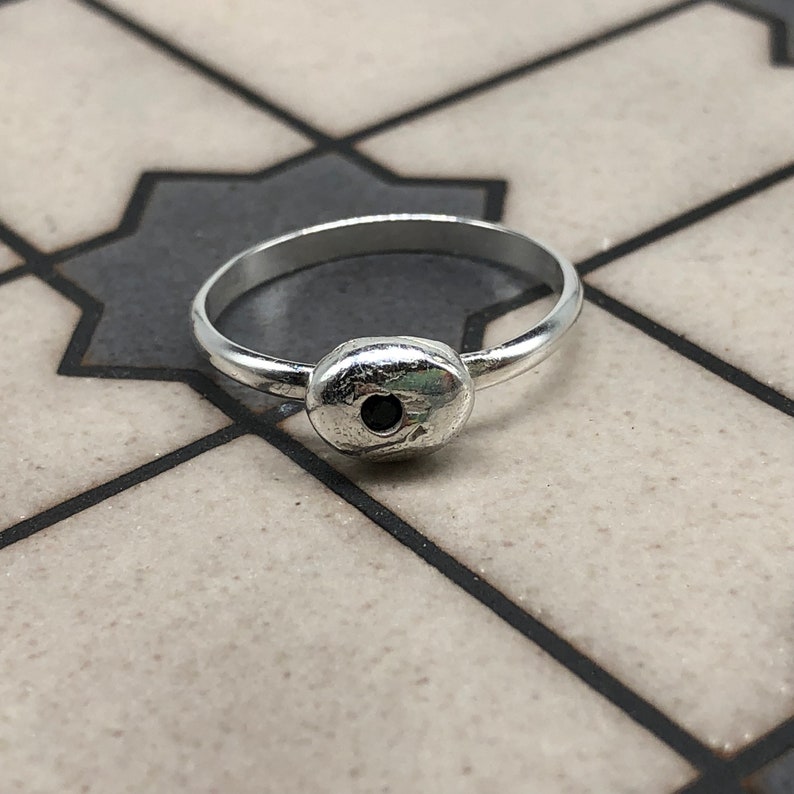 silver ring with black spinel