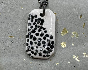 black dotted pendant