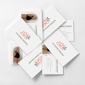 May include: A collection of white business cards arranged in a circular pattern. Each card features the "LM HOME DESIGN" logo in pink and green, along with contact information. Some cards display images of a person in a black dress.