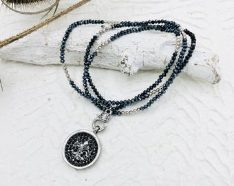long chain crystals black fleur de lis pendant