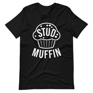May include: Black t-shirt with a white graphic of a muffin with the word "STUD" inside and the word "MUFFIN" below.