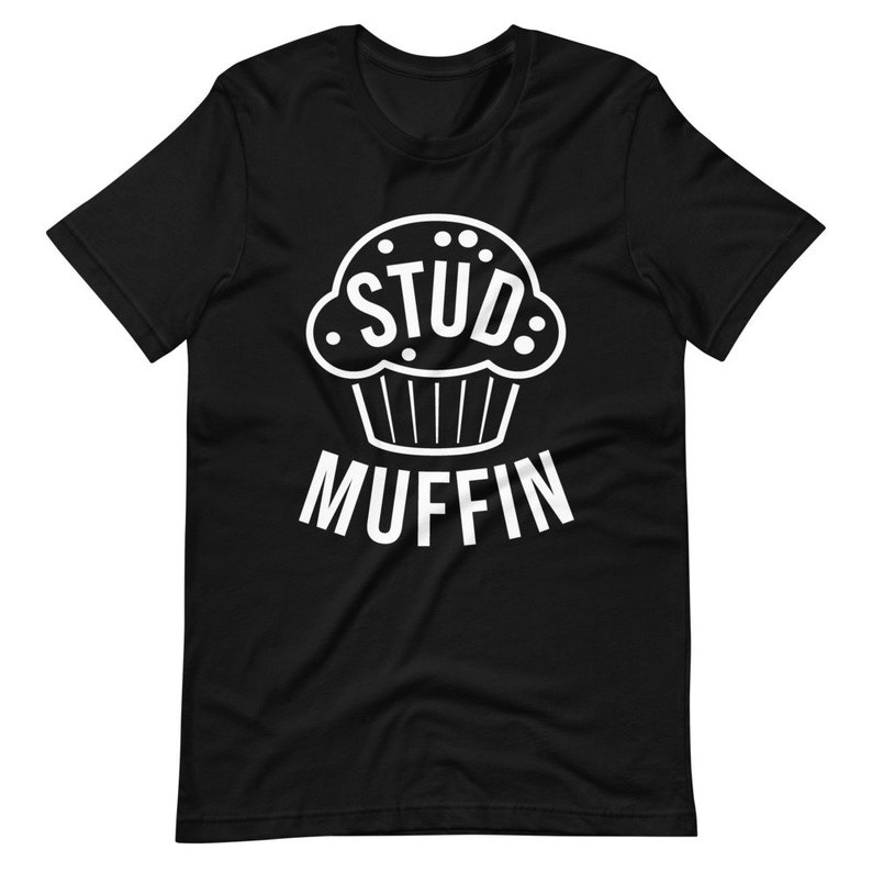 May include: Black t-shirt with a white graphic of a muffin with the word "STUD" inside and the word "MUFFIN" below.