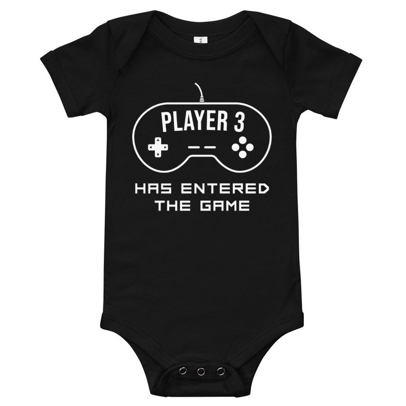 May include: Black baby onesie with a white graphic of a video game controller and the text "PLAYER 3 HAS ENTERED THE GAME".