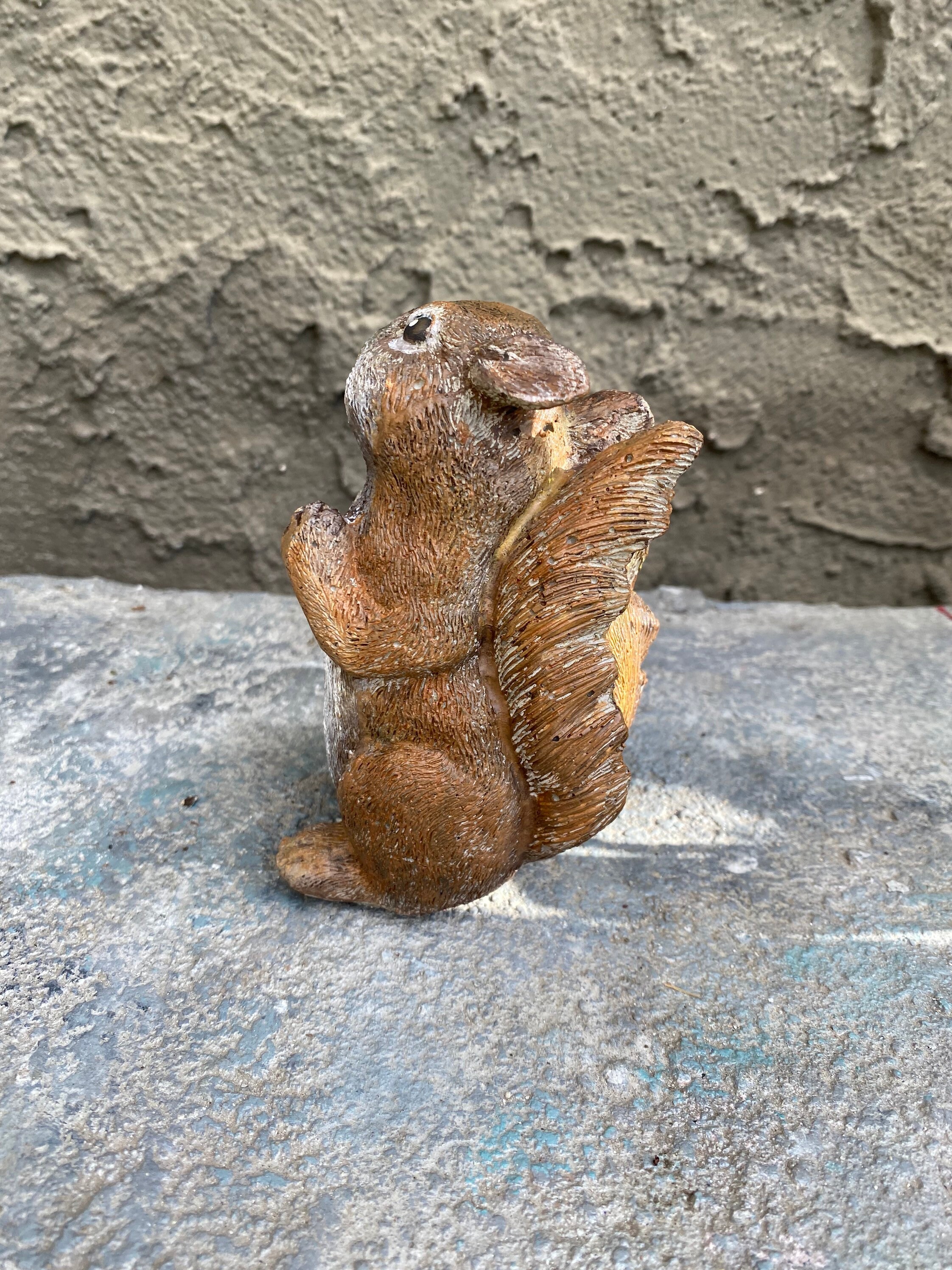 cement squirrel statue