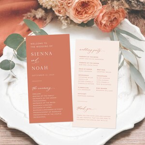 May include: Two wedding programs on a white plate with floral accents. The left program is terracotta with the names "Sienna and Noah" and wedding details. The right program is light pink with wedding party details.