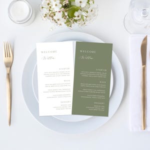 May include: Two wedding menu cards in a green and white colour scheme. The text on the cards reads "Welcome Willow" and lists the starter, main, and dessert options for the wedding reception.