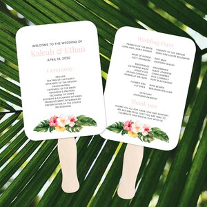 May include: A white wedding programme fan with a tropical floral design. The fan features the names Kaleah and Ethan and the date April 18, 2020. The back of the fan lists the wedding party and a thank you message.