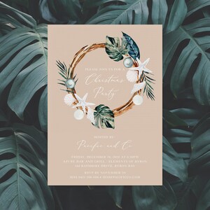 May include: A Christmas party invitation with a watercolor wreath featuring seashells, starfish, and tropical leaves. The invitation is for a party hosted by Pacific and Co. at Azure Bar and Grill in Byron Bay, Australia on December 18, 2020 at 6:30 PM.
