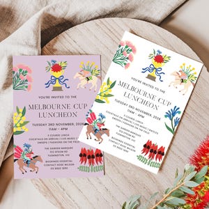 May include: Two rectangular invitations for the Melbourne Cup Luncheon on Tuesday 3rd November 2026. One card has a light purple background, the other is white. Both feature illustrations of a gold trophy, horses, and colorful native flowers.