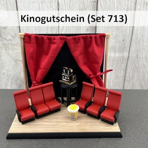 Könnte beinhalten: Ein Set aus drei Keramikbechern mit gesprenkelter, matter Oberfläche. Die Becher sind in Creme-, Hellgrau- und Dunkelgrautönen gehalten. Jeder Becher hat ein schlichtes, minimalistisches Design.