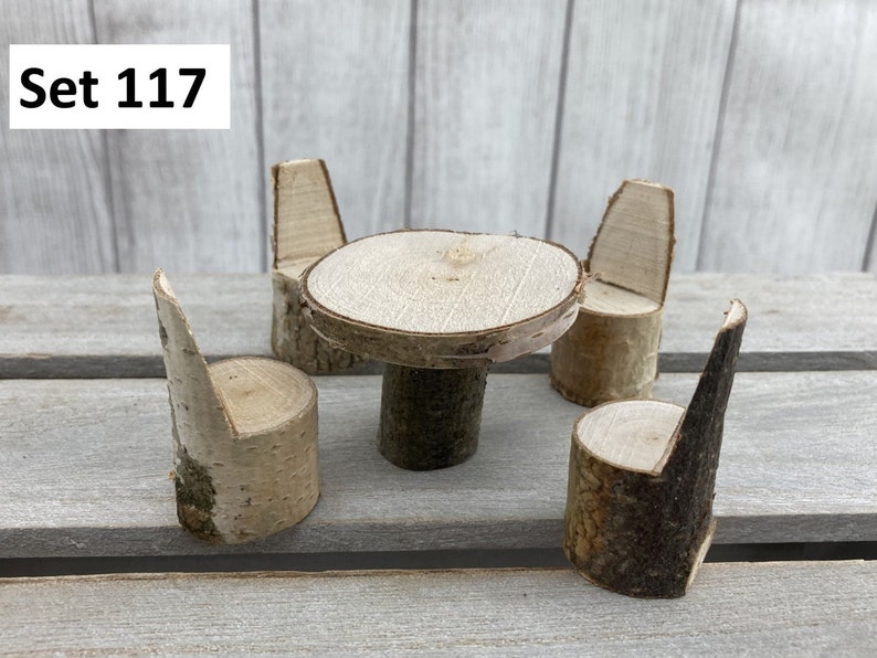 May include: Set of four miniature wooden chairs and a table made from birch logs. The set is perfect for a dollhouse or fairy garden.