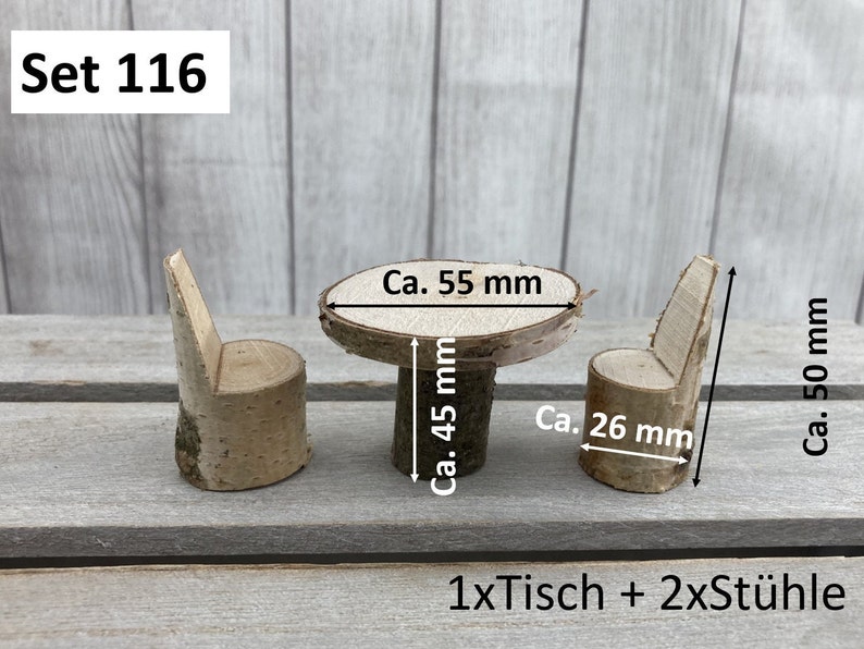 May include: A set of miniature wooden furniture, including a table and two chairs, made from natural birch wood. The table is approximately 5.5 cm in diameter and 4.5 cm tall. The chairs are approximately 2.6 cm wide and 5 cm tall. The set is labelled "Set 116" and "1xTisch + 2xSt&uuml;hle".