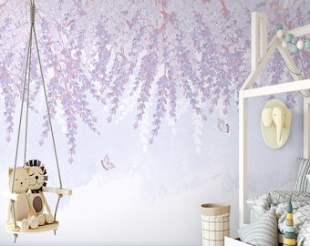 May include: A light purple and white floral wallpaper with a hanging swing and two stuffed animals. The swing is made of wood and rope and has a light brown lion and a white cat sitting on it. There are two butterflies flying in the air. The wallpaper is a watercolor style and has a soft, dreamy feel.