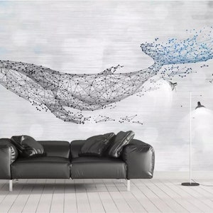 May include: A black leather sofa with a geometric whale design on the wall behind it. The whale is made of connected lines and dots, and is in shades of blue and gray.