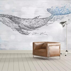 May include: A geometric whale illustration in black and blue on a white background. The whale is made up of connected lines and dots, creating a modern and abstract design.