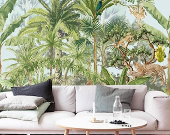 May include: A white sofa with cushions sits in front of a tropical jungle mural featuring lush green foliage, palm trees, and exotic animals such as monkeys and a leopard.