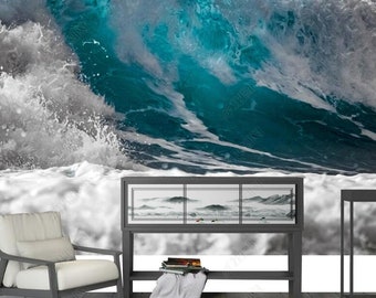 Puede incluir: Una gran ola rompiendo contra la costa, con espuma blanca y agua azul. La ola está parcialmente oscurecida por un fondo blanco similar a una nube. La imagen es adecuada para un mural de pared o una impresión grande.