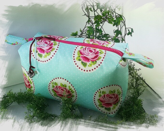 makeup bag, travel first aid kit, toiletry bag