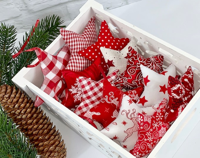 A red and white star tree made of fabric. Fabric selection, fabric stars, stars made of fabric, stars for decoration, sewn stars, star, deer, reindeer
