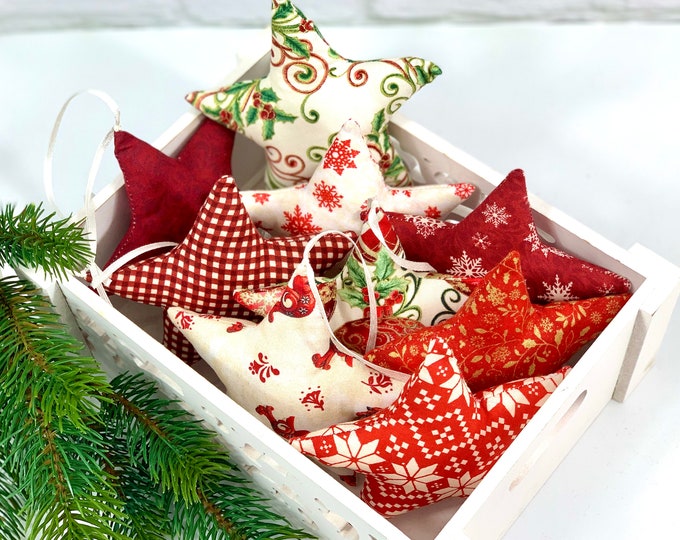 A red-cream star made of fabric. Fabric selection, fabric stars, stars made of fabric, stars for decoration, sewn stars, star, deer, reindeer