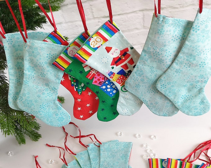 Advent calendar boots, socks, and pouches made from beautiful printed cotton fabrics, washable, turquoise - multicolored. Advent calendar to fill.