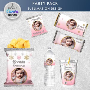 May include: A party pack sublimation design featuring a pink and white color scheme with a snowflake and gold glitter theme. The design includes a chip bag, a water bottle label, a juice box label, and two candy bar wrappers. Each design features a photo of a baby girl and the text "Brenda Birthday 1st".