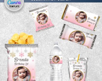 May include: A party pack sublimation design featuring a pink and white color scheme with a snowflake and gold glitter theme. The design includes a chip bag, a water bottle label, a juice box label, and two candy bar wrappers. Each design features a photo of a baby girl and the text "Brenda Birthday 1st".