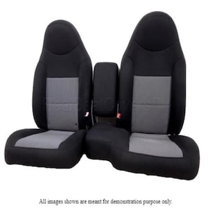May include: Black and gray car seat covers. The seats have a two-tone design with a gray center panel and black borders. The image shows two front seats and a center console.