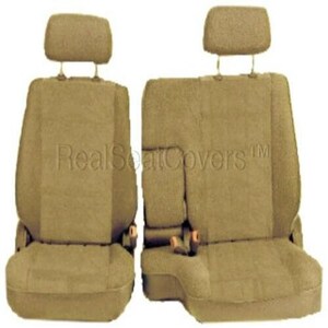 May include: Two beige car seat covers with headrests. The seat covers are made of a soft, plush fabric. The text "RealSeatCovers™" is printed on the back of the seat covers.