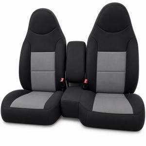 May include: Two automotive bucket seats with a center console, featuring a black outer frame and grey central panels on the backrests and seat cushions. Each seat includes a red seatbelt buckle attachment point at the base of the backrest.