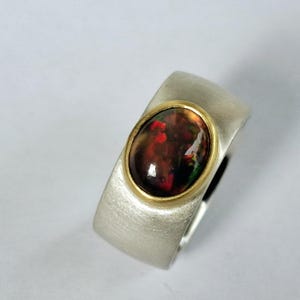Ring in solid silver with beautiful oval opal set in gold by Frank Schwope, unique jewelry, goldsmith&#39;s work, ring, black opal, opal