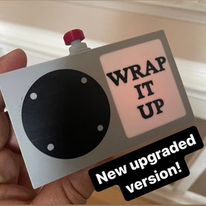 Working wrap it up box with speaker, play button and rechargeable battery from the Chappelle show