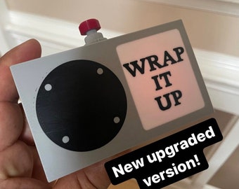 Working wrap it up box with speaker, play button and rechargeable battery from the Chappelle show